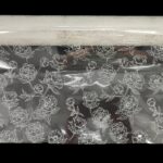 ROLO CELOFANE 70CMX50MTS FLORES COR:BRANCO